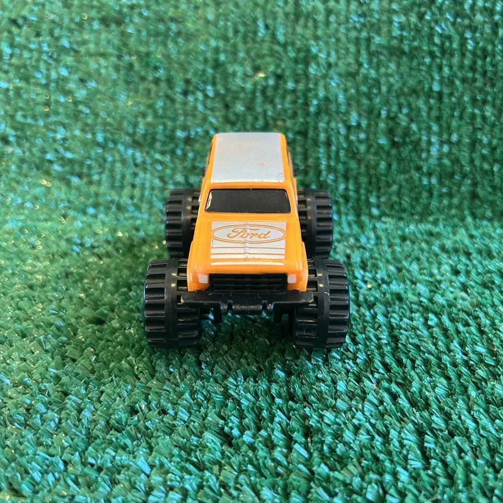 McDonalds Happy Meal Toys‎ 1987 Ford Bigfoot Trucks, orange truck